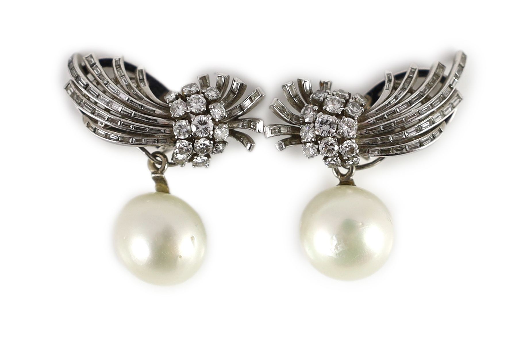 A pair of platinum, pearl and round and baguette cut diamond set spray drop ear clips